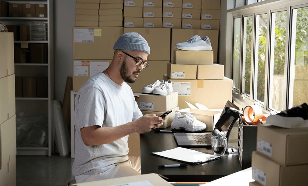 A small business owner managing his records through the Annex platform on his phone. 


